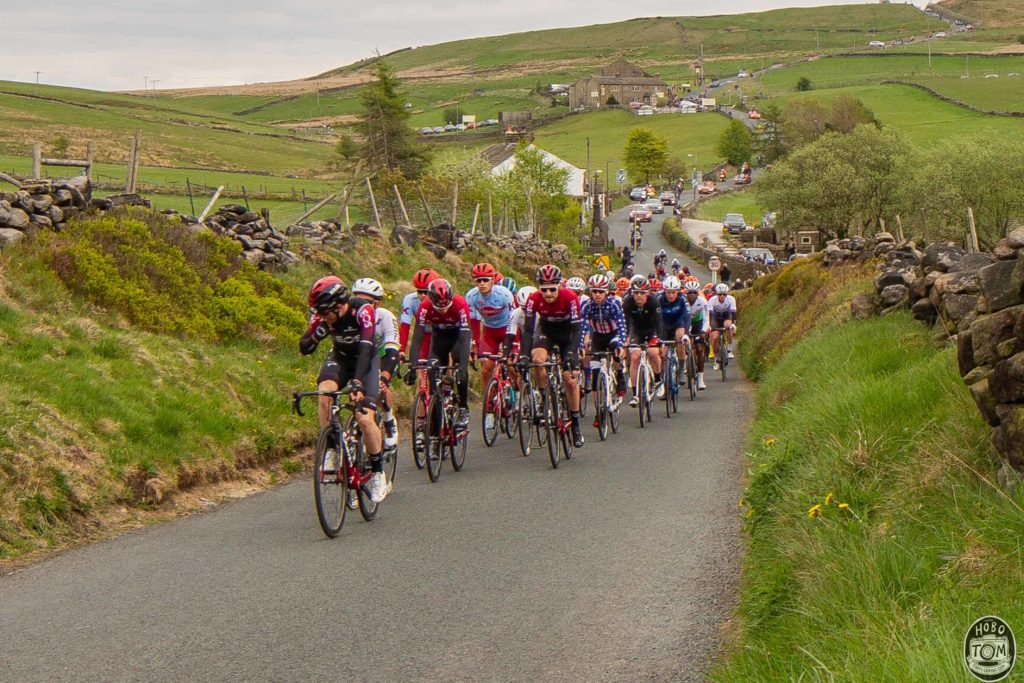 The peloton heading up Black Moor road, Oxenhope
